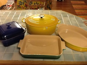 Le Creuset cast iron oven and three different bakers. Don't mix them up and put the bakeware on the stove!